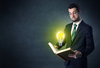 Businessman holding a book.