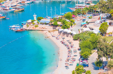 Naklejka premium Holidaymakers sunbathing at Kalkan beach,