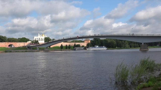 The view of the pedestrian bridge and the dome of the Hagia Sophia on a cloudy day. Veliky Novgorod, Russia