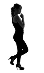 Obraz na płótnie Canvas stylish silhouette of caucasian woman posin