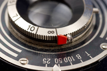 Vintage camera lens with time and distance setting scales