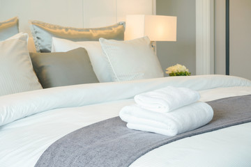 Fototapeta Clean towels on bed at hotel room obraz