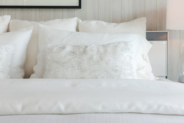 White shade pillows on off-white elegant bedding style interior bedroom