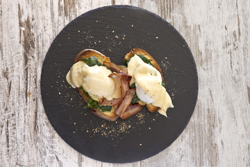 Bacon and poached egg open sandwich from above