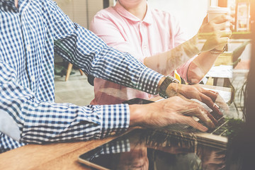 Start up partners are working in casual clothes, discussing the ideas for new strategy of development.