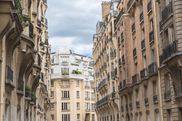 Fototapeta na wymiar Paris, typical street in a stylish district with beautiful buildings 