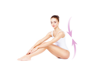 Obraz premium Beautiful fit girl posing on isolated background with drawing arrows. Health, sport, fitness, nutrition, epilation, cellulite and hair removal, liposuction, healthy life-style concept.
