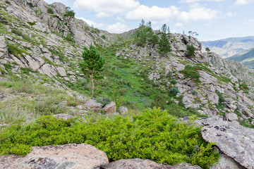 Beautiful mountain landscape, rocks and blue sky with clouds
