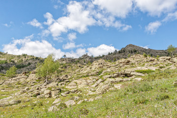 Fototapeta na wymiar Beautiful mountain landscape, rocks and blue sky with clouds