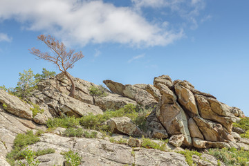 Beautiful mountain landscape, rocks and blue sky with clouds