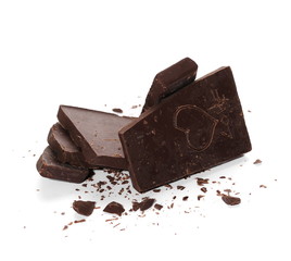 Chopped chocolate bars with carved heart isolated on white background