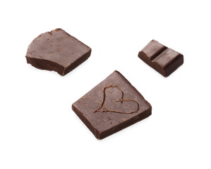 Chocolate bars with carved heart isolated on white background
