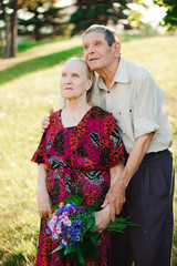 Happy elderly couple at nature
