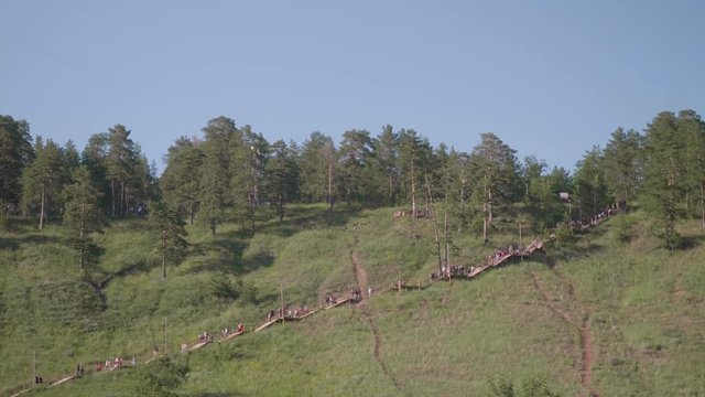 View of pathway in mountains with people on it going down