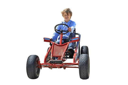 Young boy driving a Quadricycle
