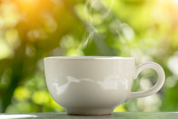 White coffee cup in the morning time
