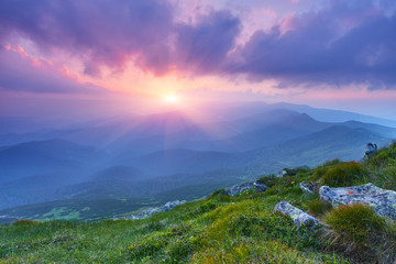 summer landscape in the mountains with the sun at dawn
