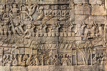 Fototapeta na wymiar Bas-relief Sculpture at Bayon temple in Angkor Thom, Siemreap, Cambodia. Angkor Thom is a popular tourist attraction.