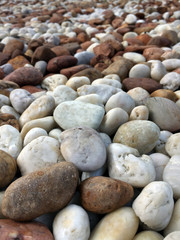 Smooth brown, black, gray, white pebbles or stones for use decor and garden landscaping. Its a small stone made smooth and round for decoration.
