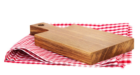 Wooden kitchen empty board on red picnic cloth isolated.