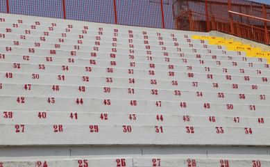 Fototapeta premium many numbers on the stadium bleachers to indicate a seat at even