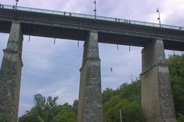 Man riding on troll under the bridge