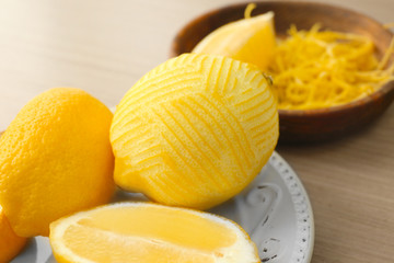 Plate with fresh lemons, closeup