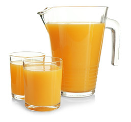Pitcher and glasses of fresh orange juice on white background