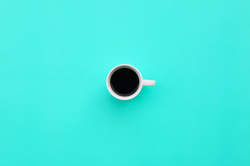 Cup of coffee on blue background