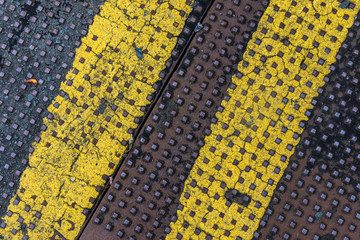 Double yellow line grunge street metal manhole