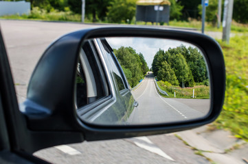 landscape in the car mirror