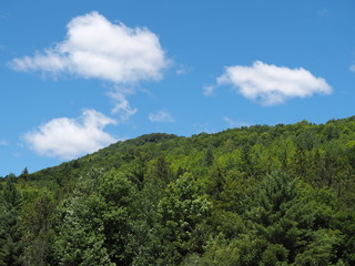 Beautiful Vermont green mountain and summer clouds