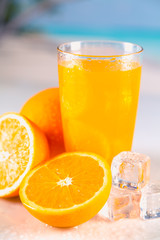 Fresh and cold orange juice served on beach