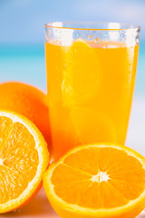 Fresh and cold orange juice served on beach
