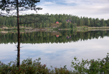 Red house reflecting in lake