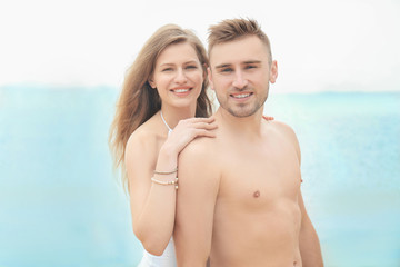 Fototapeta premium Young loving couple on seashore