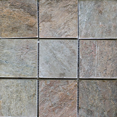 Abstract, geometric, tiled pattern of solid stone