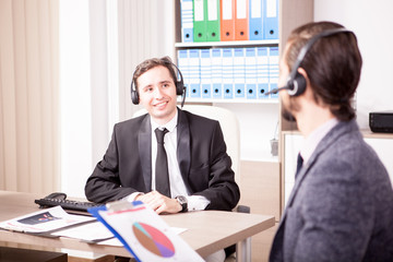 Customer service support working in office. Professional online and telephone assistant support