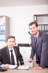 Businessman in suits working in office. Teamwok and meetings. Professional communication