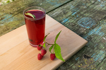 Summer refreshing fruit drink on a wooden table