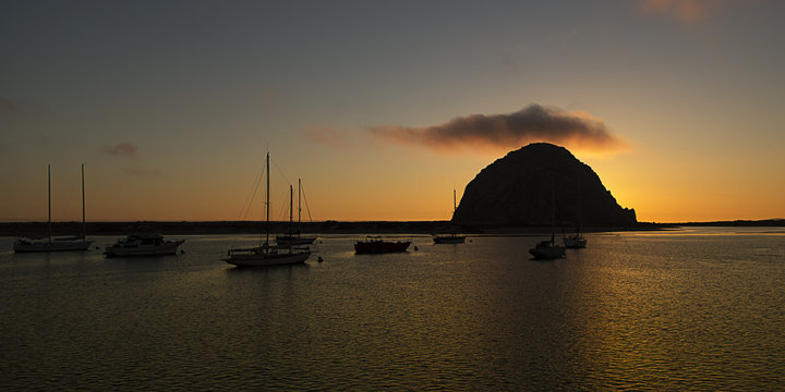 Color Image Of Multiple Sailboats At Sunset In Morro Bay CA