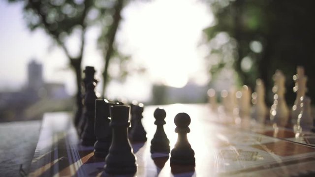Close up wooden chess pieces on board, dolly shot, close up
