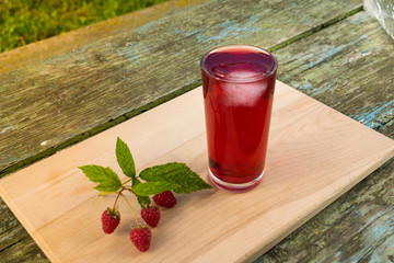 Summer refreshing fruit drink on a wooden table