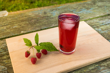 Summer refreshing fruit drink on a wooden table