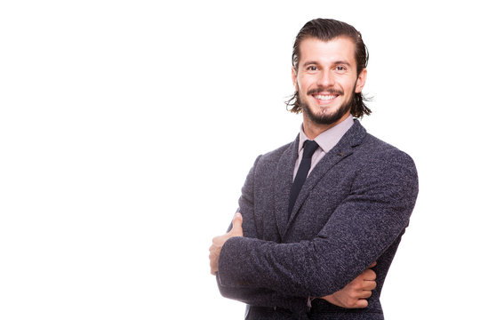 Confident smiling businessman in formal wear isolated over white background in studio photo