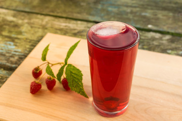 Summer refreshing fruit drink on a wooden table
