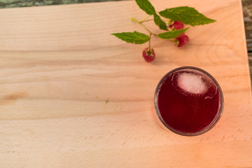 Summer refreshing fruit drink on a wooden table