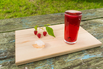 Summer refreshing fruit drink on a wooden table