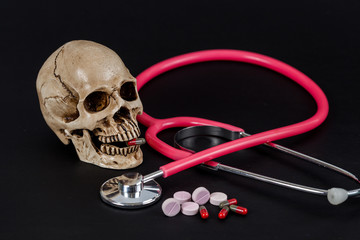 skull with drug or medicine and stethoscope