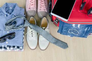 Obraz premium travel accessories and costume on wood floor, Top view